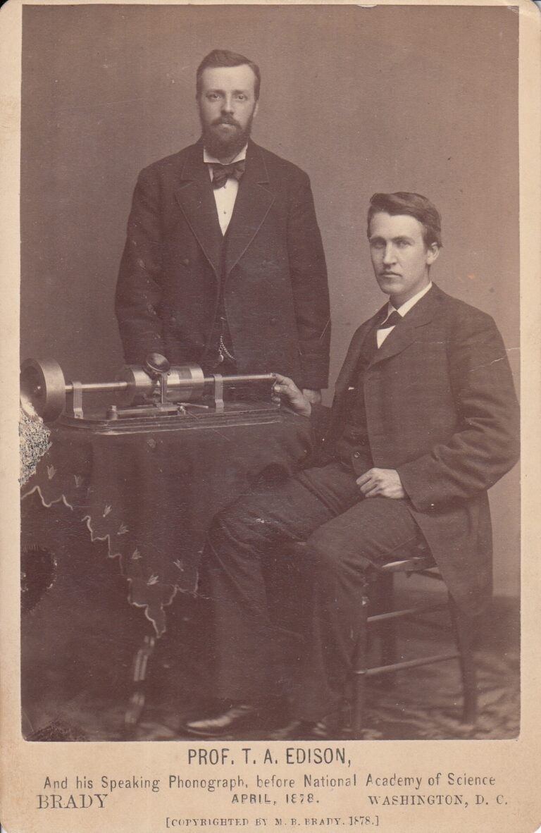 Thomas Edison and Charles Batchelor demonstrating the tinfoil phonograph in 1878