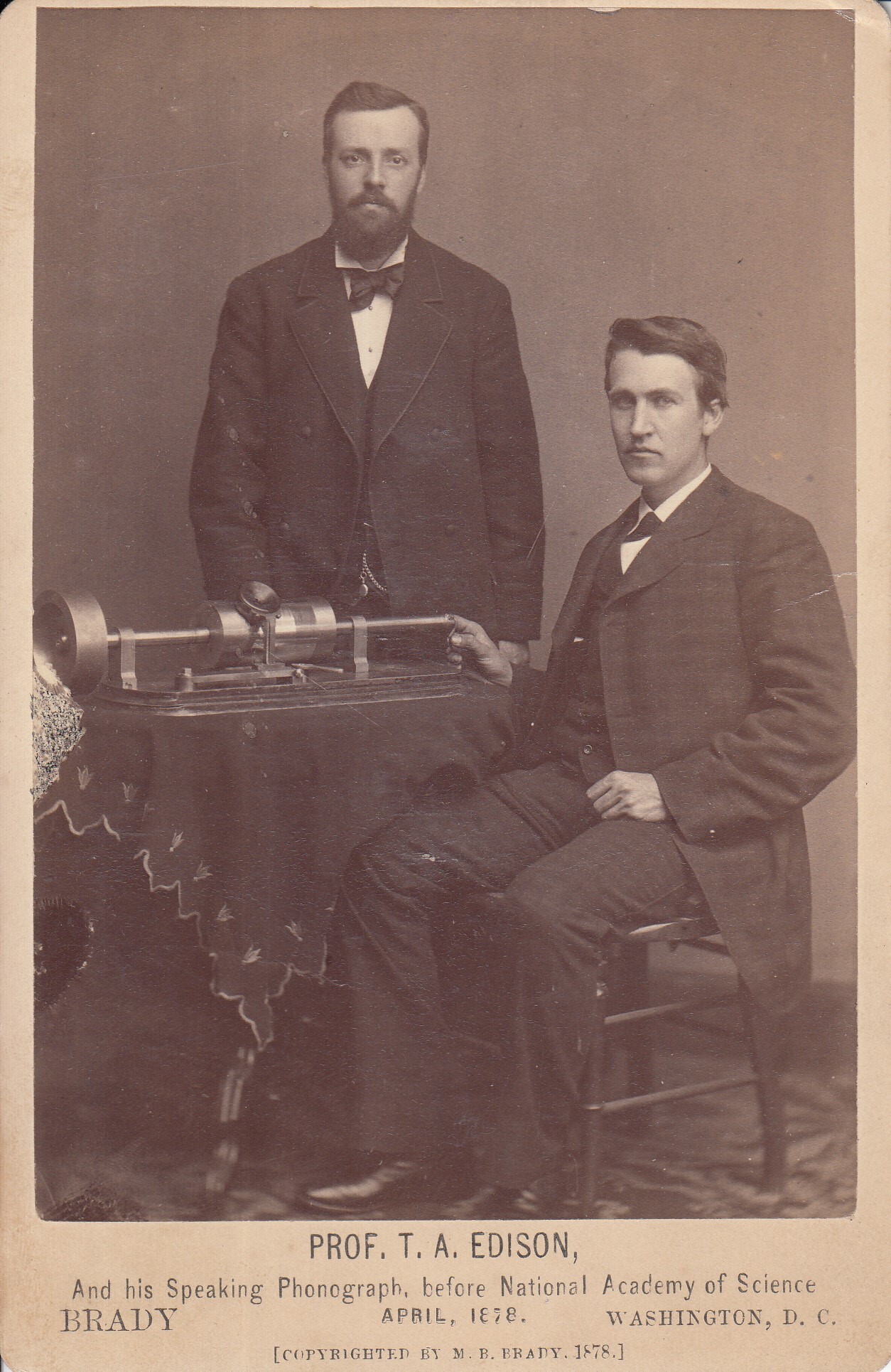 Thomas Edison and Charles Batchelor demonstrating the tinfoil phonograph in 1878