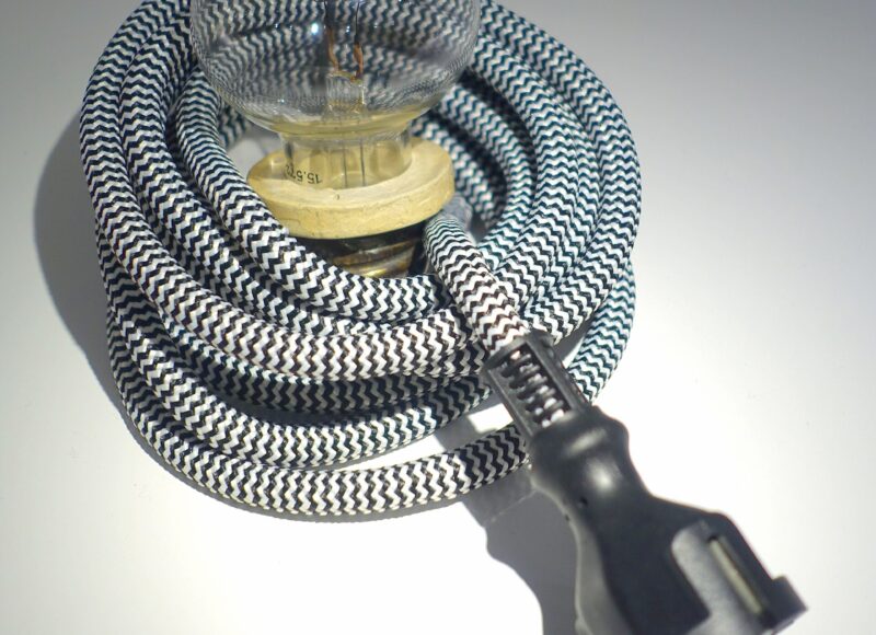 An Edison incandescent electric lamp manufactured in 1881 with carbon filament visible