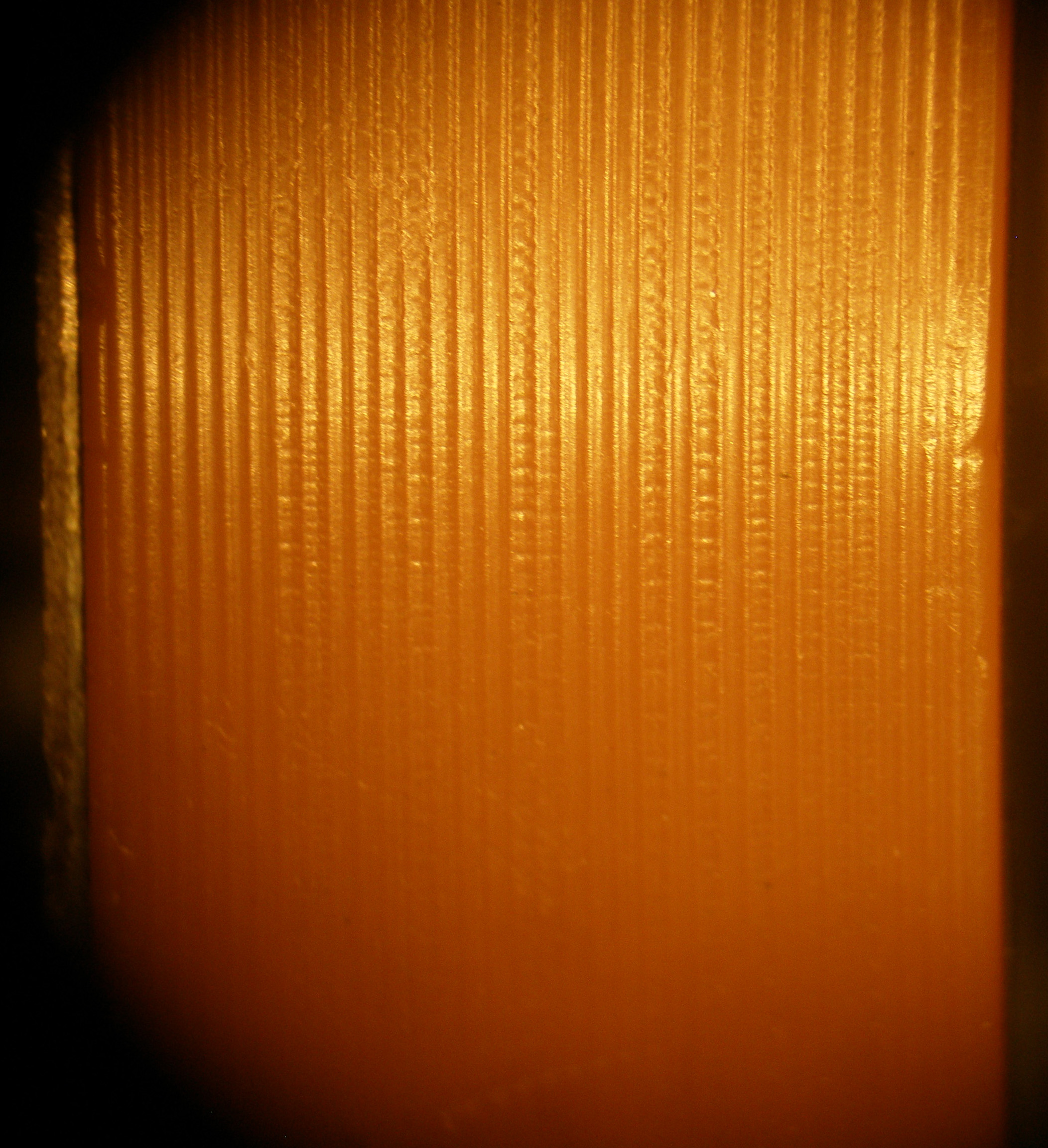 Close view of the groove surface on an Edison talking doll cylinder