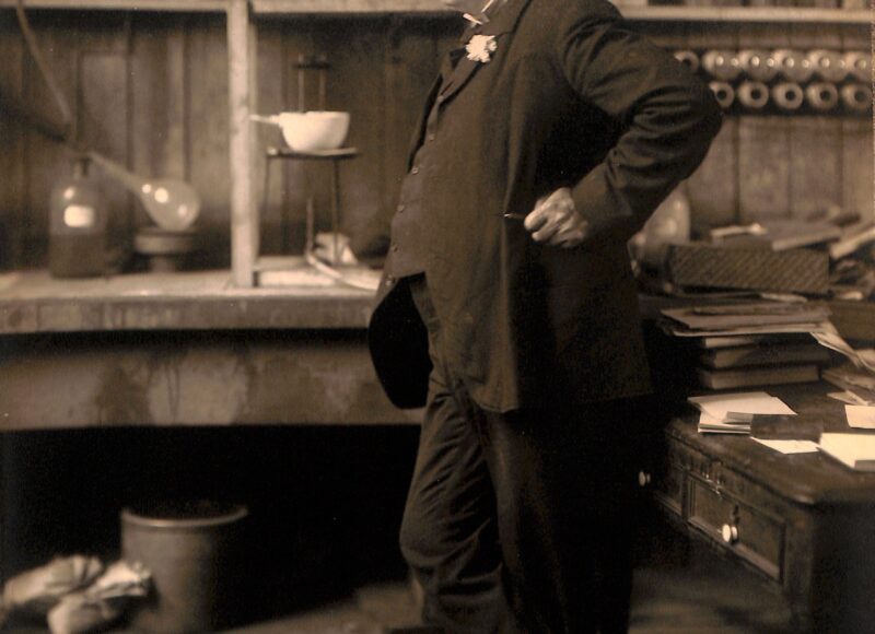 Thomas Edison standing among electrical apparatus in his West Orange laboratory in 1906